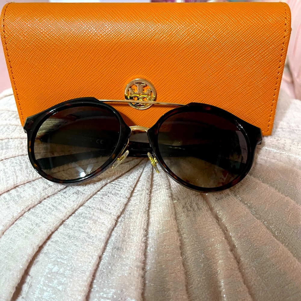 Tory Burch tortoise sunglasses in good condition .